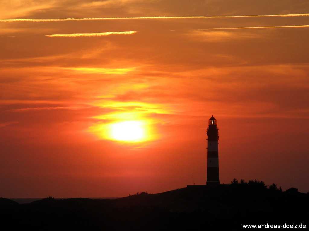 Fotografía zum Sonnenuntergang am Leuchtturm am See